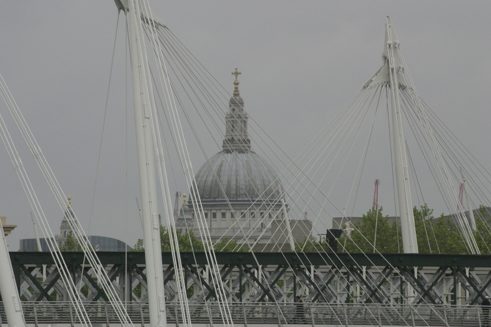 St Pauls Cathedral seen through the supporting cables of Hungerford Bridge.
