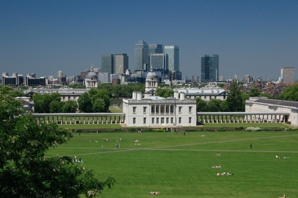 Queen Annes House and Canary Wharf with Greenwich Park in the foreground.